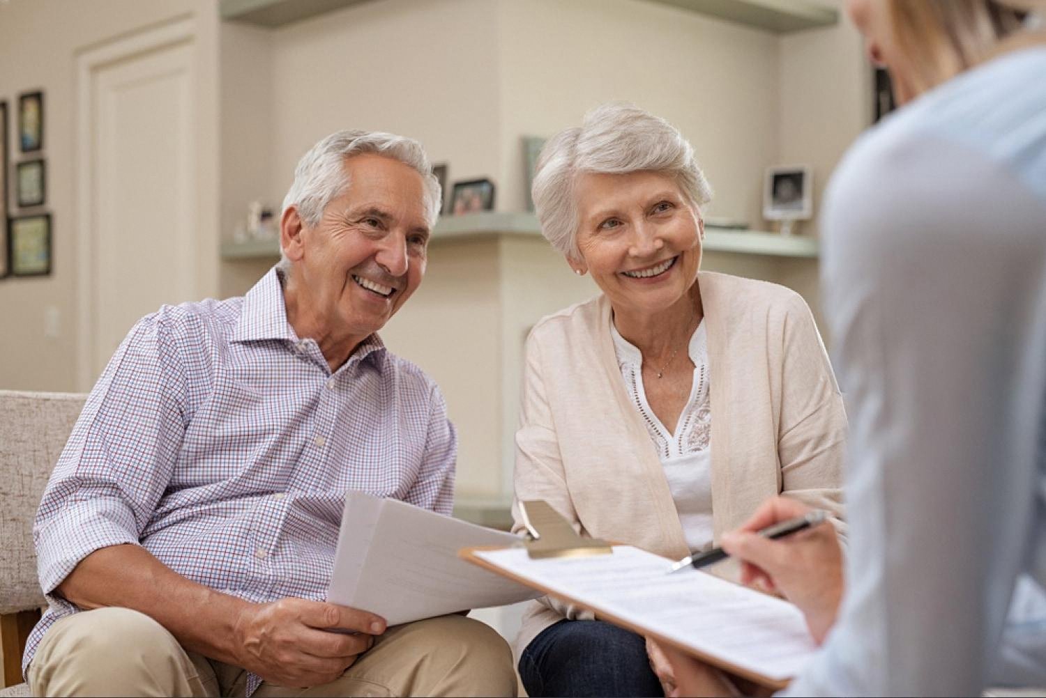 Senior couple reviewing a will and succession plan with an advisor in Dubai